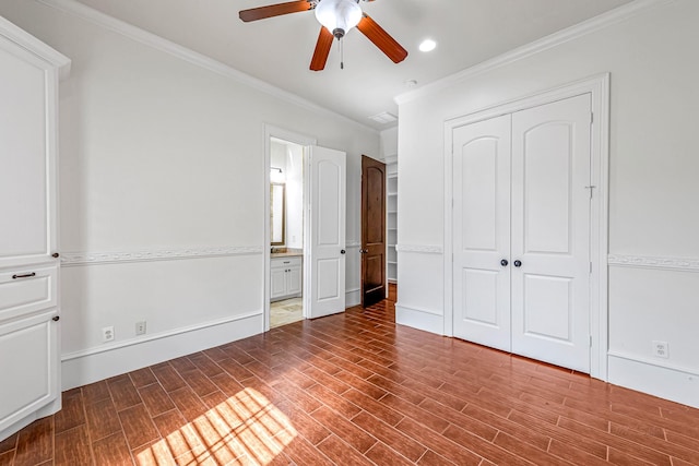 1006 Cross Hollow Ln, Katy, TX 77494 - unfurnished bedroom featuring ensuite bathroom, ornamental molding, a closet, and wood finished floors