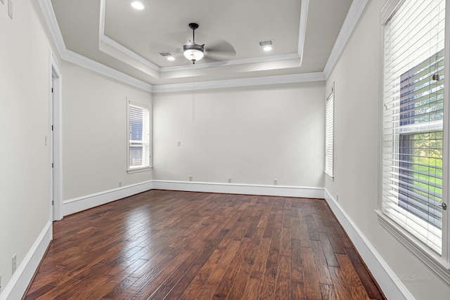 1006 Cross Hollow Ln, Katy, TX 77494 - empty room featuring a ceiling fan, healthy amount of natural light, ornamental molding, a raised ceiling, and dark wood-style flooring