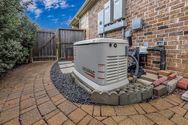 1006 Cross Hollow Ln, Katy, TX 77494 - exterior view of a power unit, brick siding, a gate, fence, and electric meter