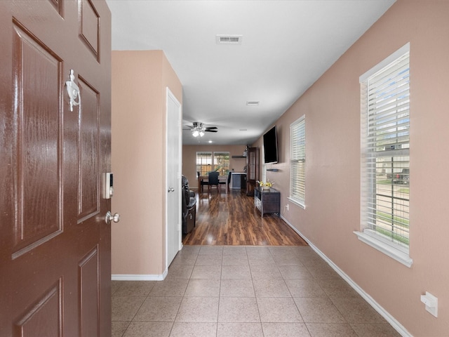 7914 Cypress Edge Dr, Cypress, TX 77433 - entryway with baseboards, light tile patterned flooring, and a ceiling fan