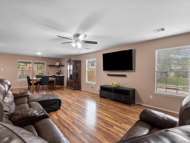 7914 Cypress Edge Dr, Cypress, TX 77433 - living area with baseboards, wood finished floors, and ceiling fan