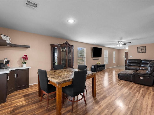 7914 Cypress Edge Dr, Cypress, TX 77433 - dining space with wood finished floors, a ceiling fan, baseboards, and recessed lighting