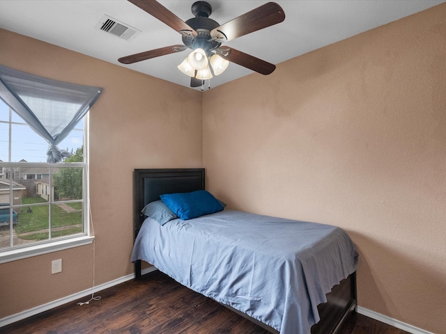 7914 Cypress Edge Dr, Cypress, TX 77433 - bedroom with wood finished floors, multiple windows, baseboards, and a ceiling fan