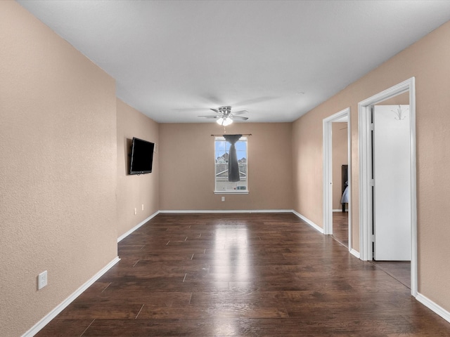 7914 Cypress Edge Dr, Cypress, TX 77433 - spare room with dark wood-style floors, a ceiling fan, baseboards, and a textured wall