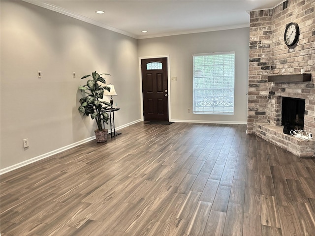 6314 1st St, Bellaire, TX 77401 - entryway with wood finished floors, baseboards, crown molding, a fireplace, and recessed lighting