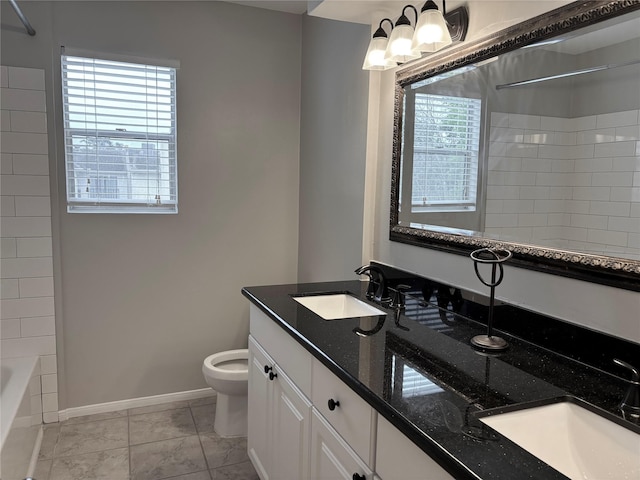 6314 1st St, Bellaire, TX 77401 - full bathroom featuring toilet, double vanity, baseboards, and a chandelier