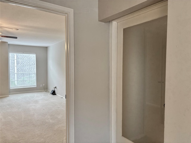 6314 1st St, Bellaire, TX 77401 - hallway with baseboards and carpet