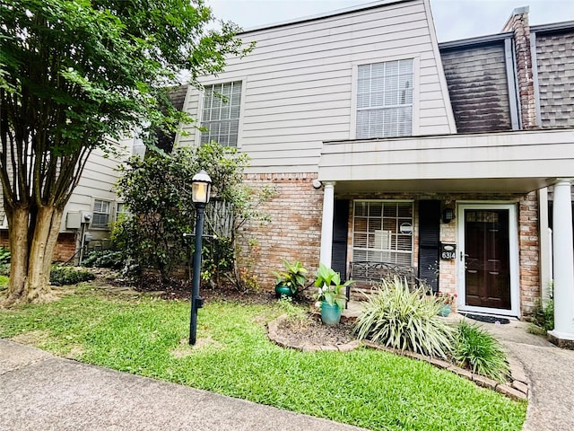 6314 1st St, Bellaire, TX 77401 - view of front of house featuring a porch and brick siding