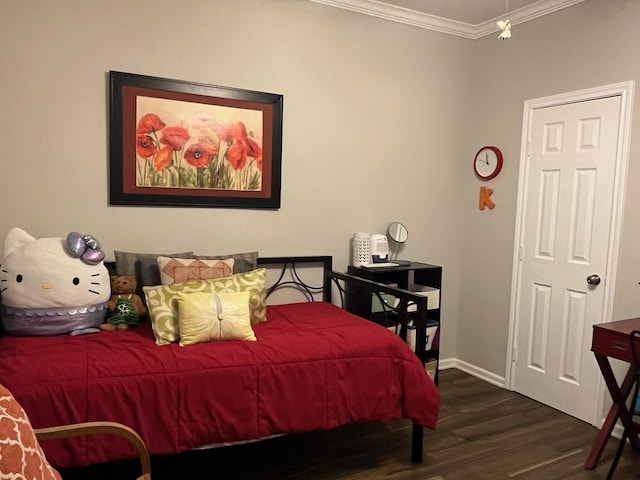 6314 1st St, Bellaire, TX 77401 - bedroom featuring ornamental molding, wood finished floors, and baseboards