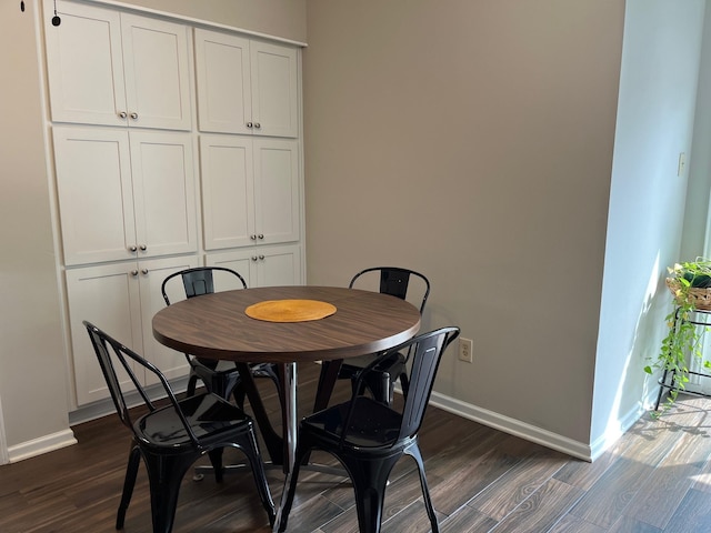 6314 1st St, Bellaire, TX 77401 - dining area featuring dark wood finished floors and baseboards