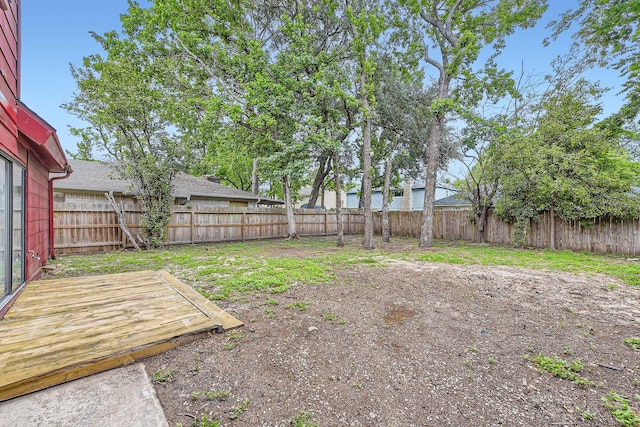 view of yard with a fenced backyard and a deck