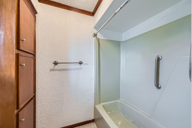 full bathroom with crown molding, a textured ceiling, and a textured wall