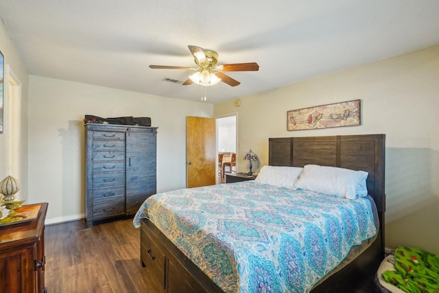 bedroom with visible vents, dark wood-style flooring, baseboards, and ceiling fan