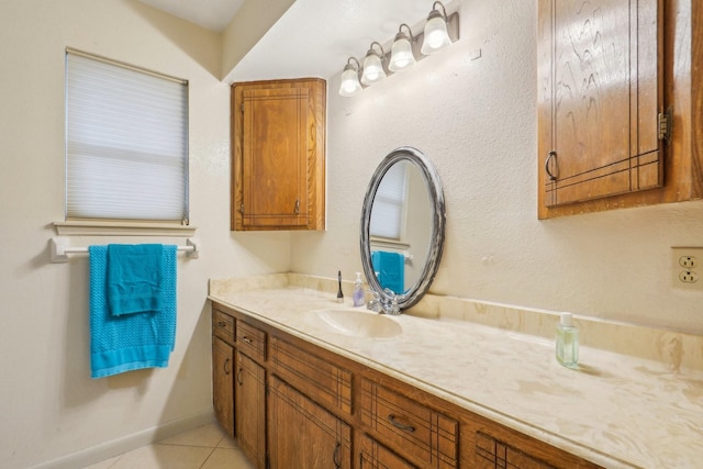 bathroom with tile patterned floors and vanity
