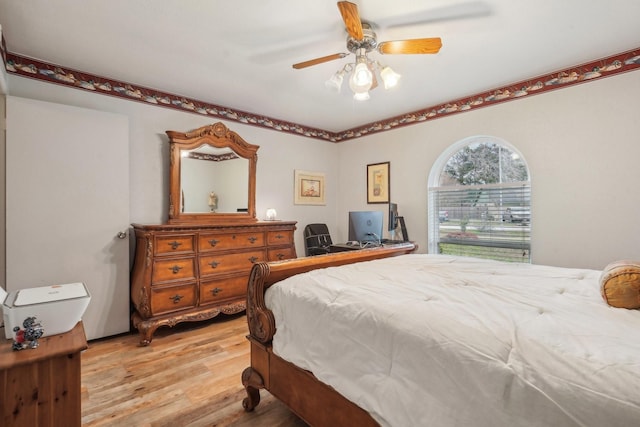 bedroom featuring light wood-type flooring and ceiling fan