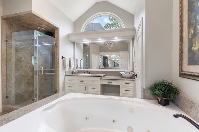 bathroom with a shower stall, a tub with jets, lofted ceiling, and vanity