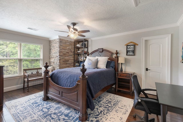 bedroom with dark wood finished floors, visible vents, baseboards, a textured ceiling, and ornamental molding