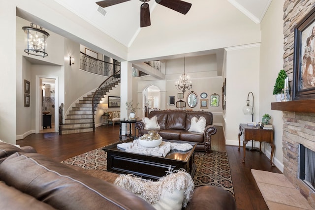 living area featuring stairs, baseboards, and hardwood / wood-style floors