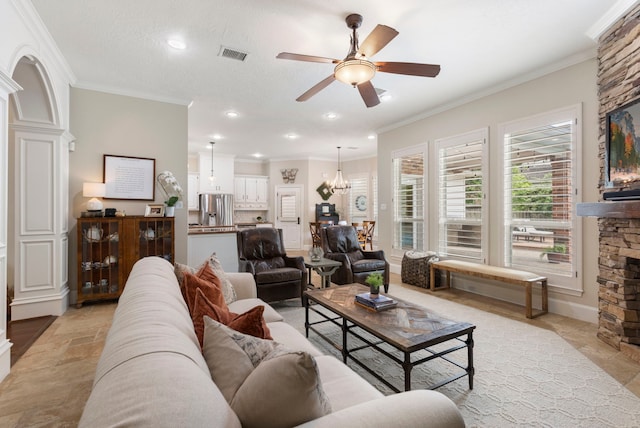 living room featuring crown molding, visible vents, ceiling fan with notable chandelier, and recessed lighting
