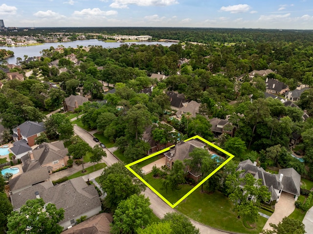 bird's eye view with a water view and a residential view