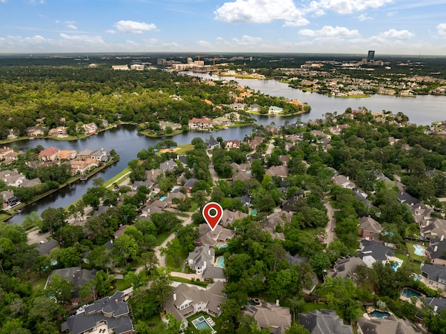 drone / aerial view with a water view and a residential view