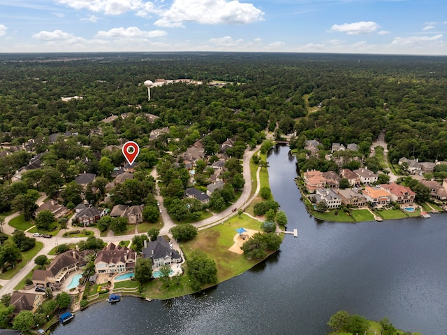 aerial view featuring a water view, a forest view, and a residential view