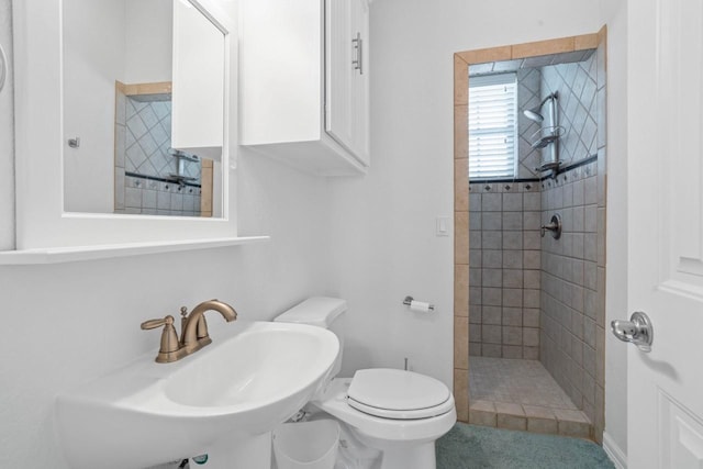 650 Dove Is, Livingston, TX 77351 - bathroom featuring toilet, a stall shower, and a sink