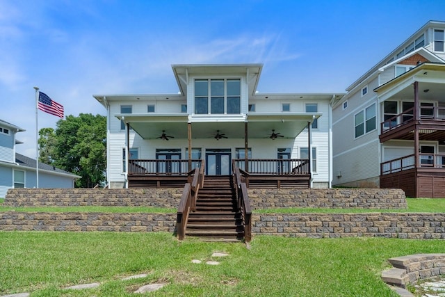 650 Dove Is, Livingston, TX 77351 - back of property featuring stairway, french doors, a lawn, and ceiling fan