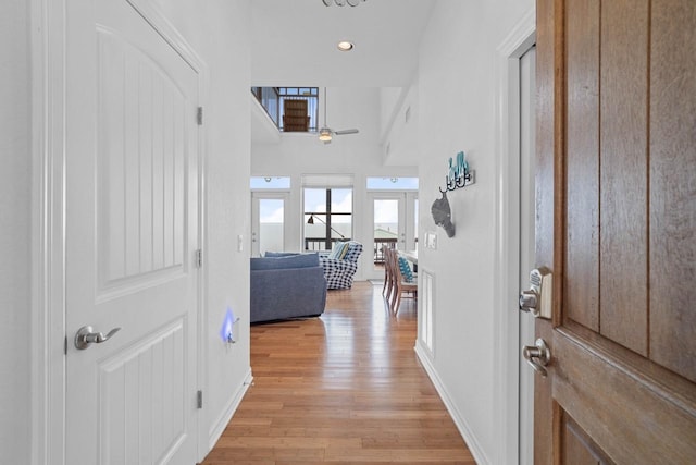 650 Dove Is, Livingston, TX 77351 - foyer entrance featuring recessed lighting, baseboards, ceiling fan, a towering ceiling, and light wood-style floors
