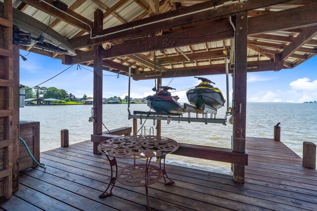 650 Dove Is, Livingston, TX 77351 - dock area with boat lift and a water view