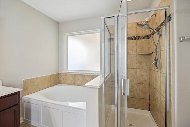 2614 Magnolia Fair Way, Spring, TX 77386 - full bathroom featuring vanity, a garden tub, and a shower stall
