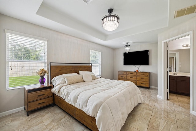 2614 Magnolia Fair Way, Spring, TX 77386 - bedroom featuring a tray ceiling, a notable chandelier, visible vents, baseboards, and marble finish floor