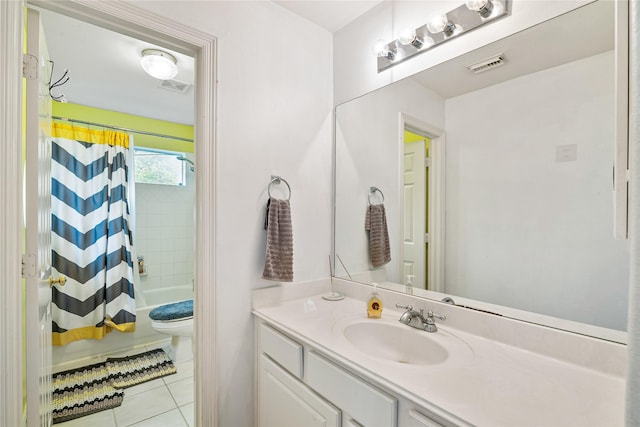 bathroom with toilet, tile patterned flooring, vanity, and visible vents