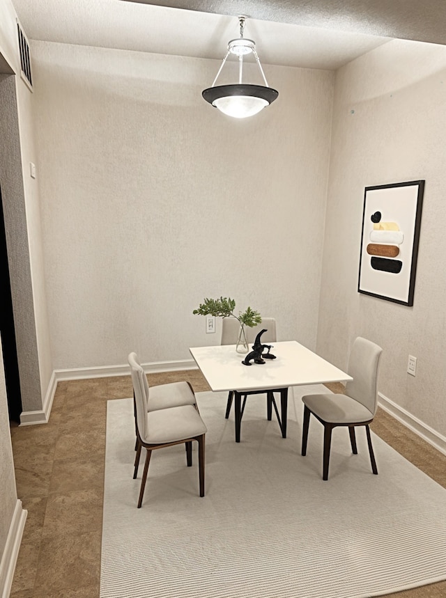 dining space with baseboards
