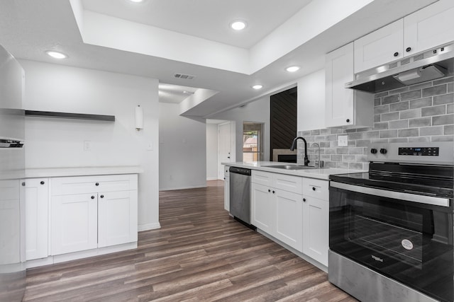 kitchen with under cabinet range hood, visible vents, a sink, open shelves, and appliances with stainless steel finishes