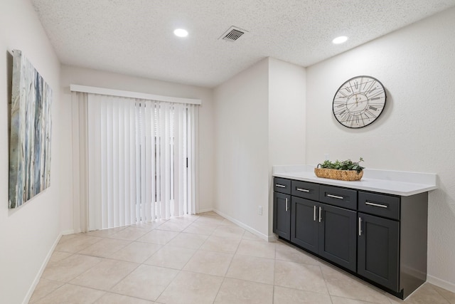 34 Quiet Peace Pl, The Woodlands, TX 77381 - bar area with a textured ceiling, baseboards, recessed lighting, and light tile patterned floors