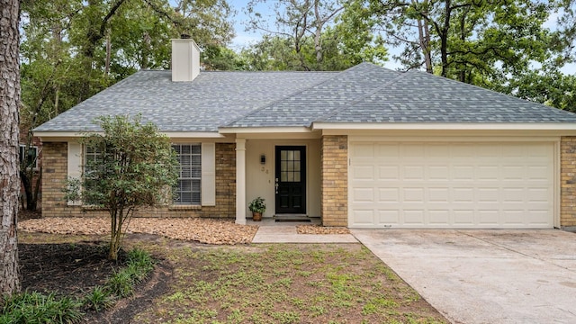 34 Quiet Peace Pl, The Woodlands, TX 77381 - single story home with a chimney, a shingled roof, and brick siding