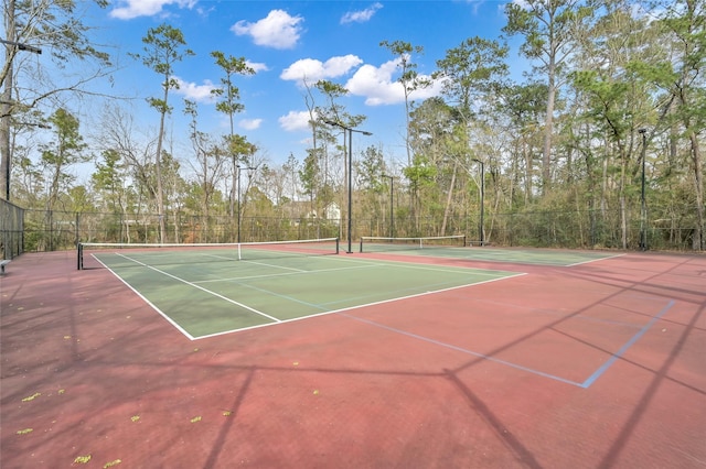 22 Almond Branch Pl, The Woodlands, TX 77382 - view of tennis court with fence and community basketball court
