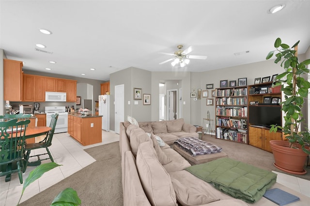 22 Almond Branch Pl, The Woodlands, TX 77382 - living area featuring a ceiling fan, light colored carpet, recessed lighting, and light tile patterned flooring