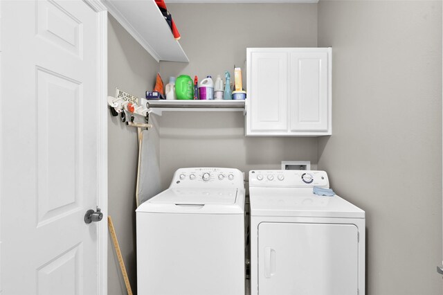 22 Almond Branch Pl, The Woodlands, TX 77382 - laundry room with independent washer and dryer and cabinet space