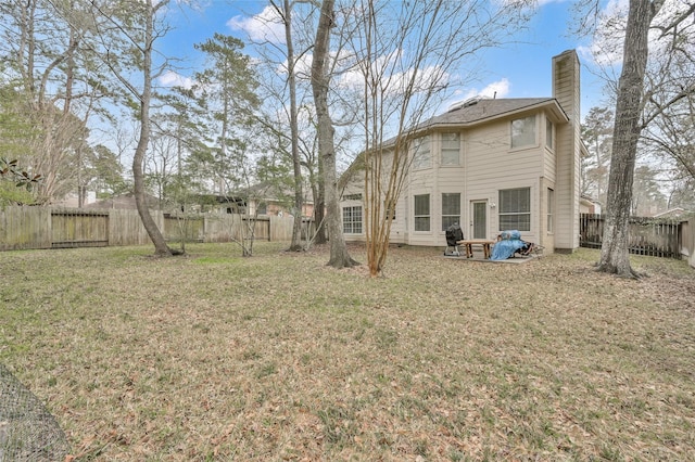 22 Almond Branch Pl, The Woodlands, TX 77382 - back of house with a chimney