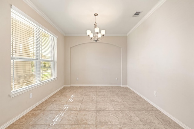 empty room with a chandelier, ornamental molding, and baseboards