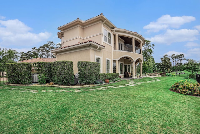 2802 Twin Fountains Dr, Houston, TX 77068 - view of front of house with a balcony, stucco siding, a front yard, and cooling unit