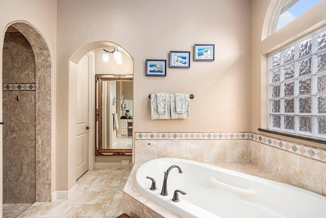2802 Twin Fountains Dr, Houston, TX 77068 - bathroom featuring a bath and tiled shower