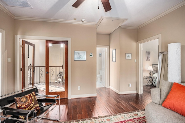 2802 Twin Fountains Dr, Houston, TX 77068 - living room with attic access, ceiling fan, wood-type flooring, ornamental molding, and baseboards