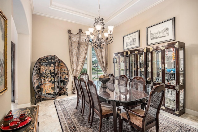 2802 Twin Fountains Dr, Houston, TX 77068 - dining space featuring a chandelier, ornamental molding, a tray ceiling, and baseboards
