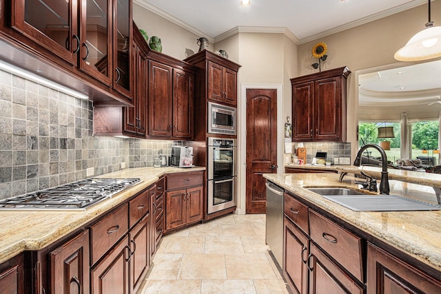 2802 Twin Fountains Dr, Houston, TX 77068 - kitchen featuring stainless steel appliances, a sink, light stone counters, decorative light fixtures, and backsplash