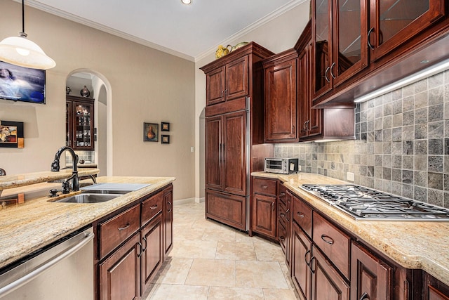 2802 Twin Fountains Dr, Houston, TX 77068 - kitchen featuring stainless steel appliances, a sink, tasteful backsplash, arched walkways, and light stone countertops