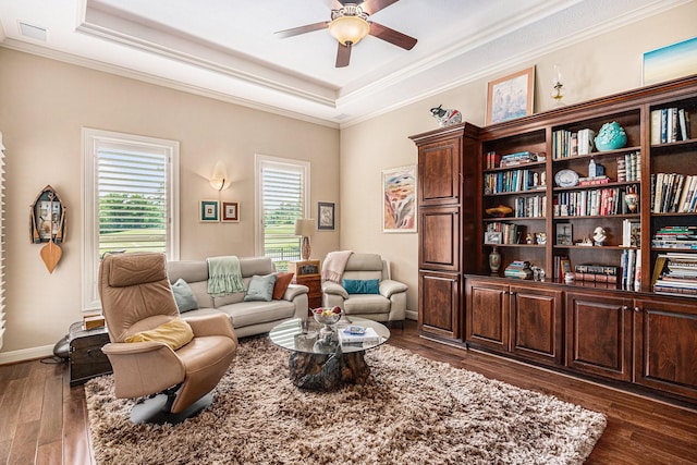 2802 Twin Fountains Dr, Houston, TX 77068 - sitting room featuring ceiling fan, a tray ceiling, dark wood-type flooring, crown molding, and baseboards