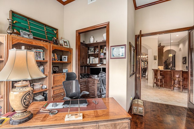 2802 Twin Fountains Dr, Houston, TX 77068 - office area with arched walkways, crown molding, dark wood-style flooring, and a high ceiling